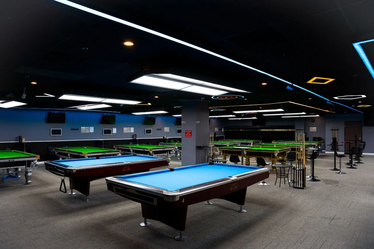 Modern billiards lounge with pool and snooker tables at iCUE Billiard Club in Rowland Heights